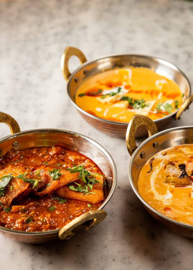 Curries in copper bowls