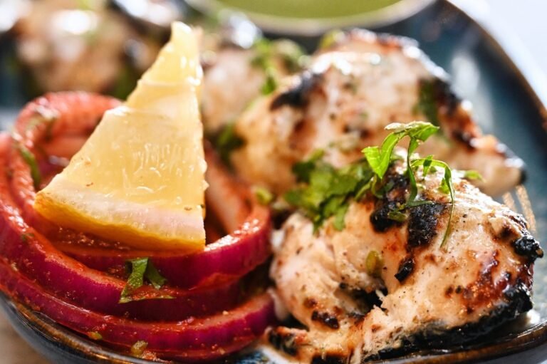 Malai chicken tikka with lemon and pickled onion
