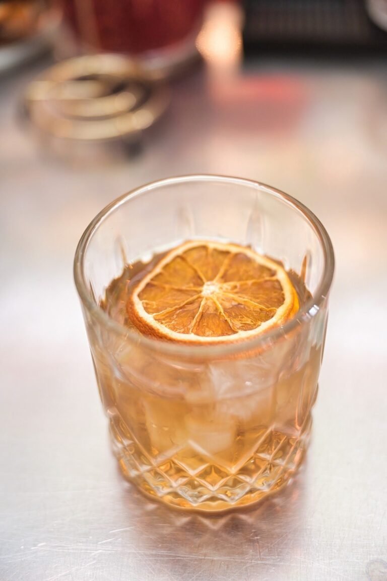 An old fashioned with a dried orange wheel