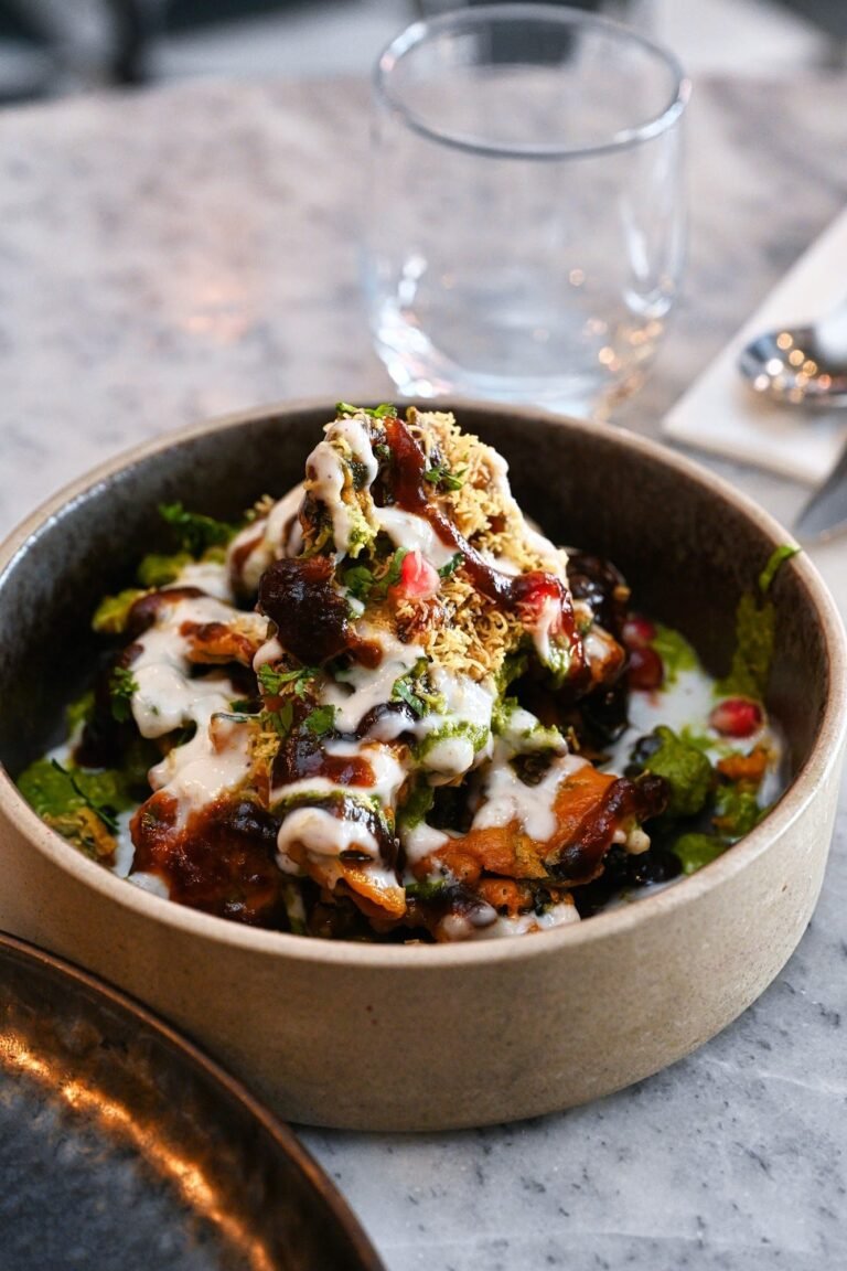Palak patta chaat: crispy spinach with yogurt, chutneys and pomegranate